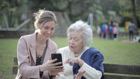 an old lady using the BigPurplePhone, touching the menu and scrolling.